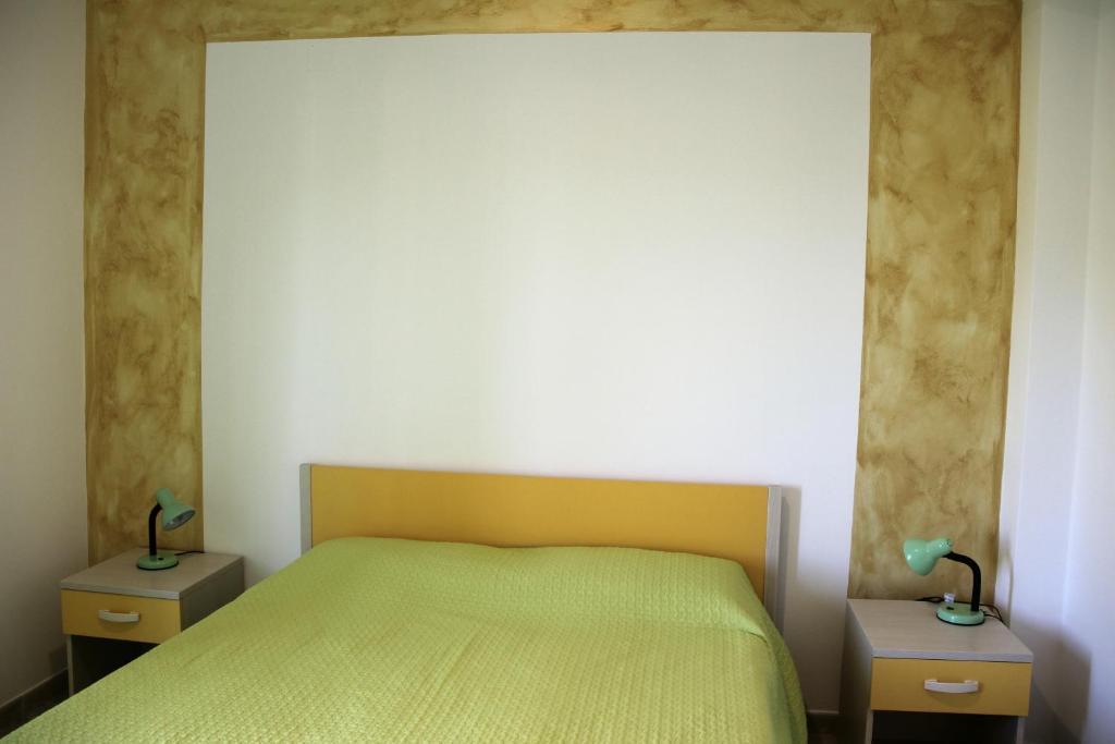 Postel nebo postele na pokoji v ubytování Lucantò Accommodations