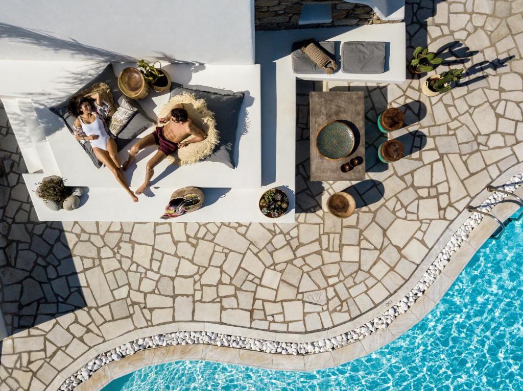 an overhead view of a pool at a resort at A Hotel Mykonos in Mikonos