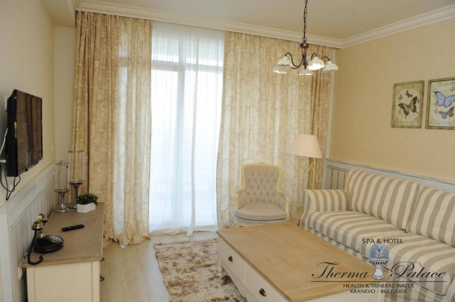 A television and/or entertainment centre at Therma Palace - All inclusive & Private Beach & Free Parking