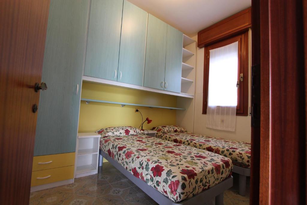 A bed or beds in a room at Villa Agavi