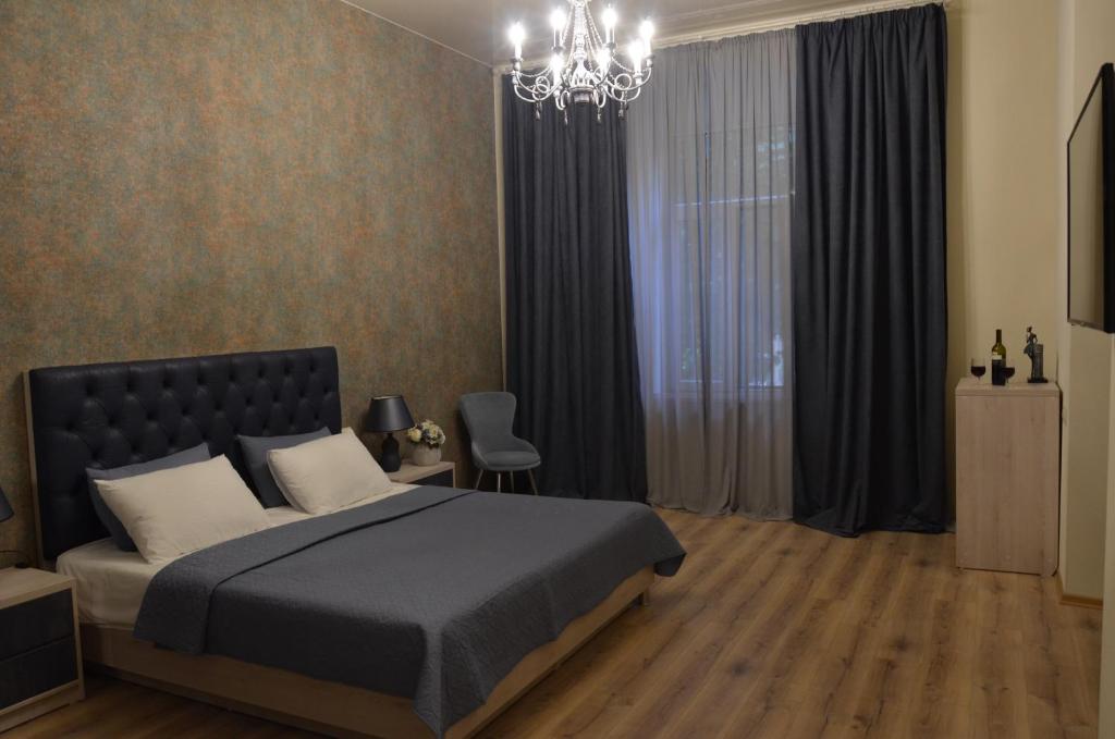 Postel nebo postele na pokoji v ubytování Hotel Griboedov