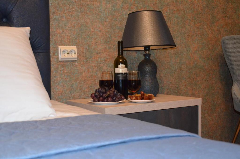 Postel nebo postele na pokoji v ubytování Hotel Griboedov