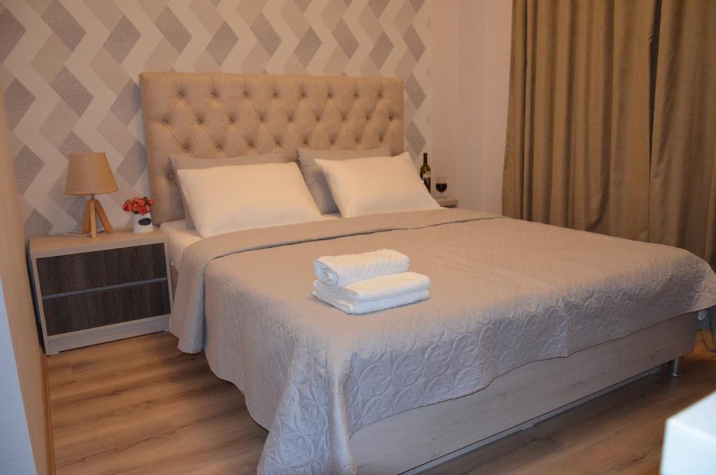 Postel nebo postele na pokoji v ubytování Hotel Griboedov