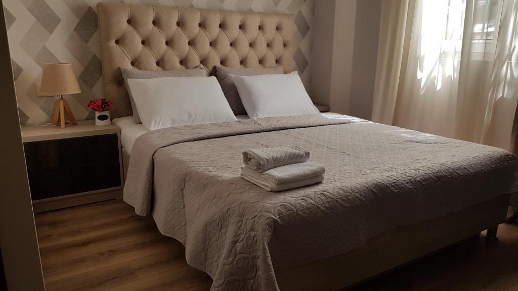 Postel nebo postele na pokoji v ubytování Hotel Griboedov