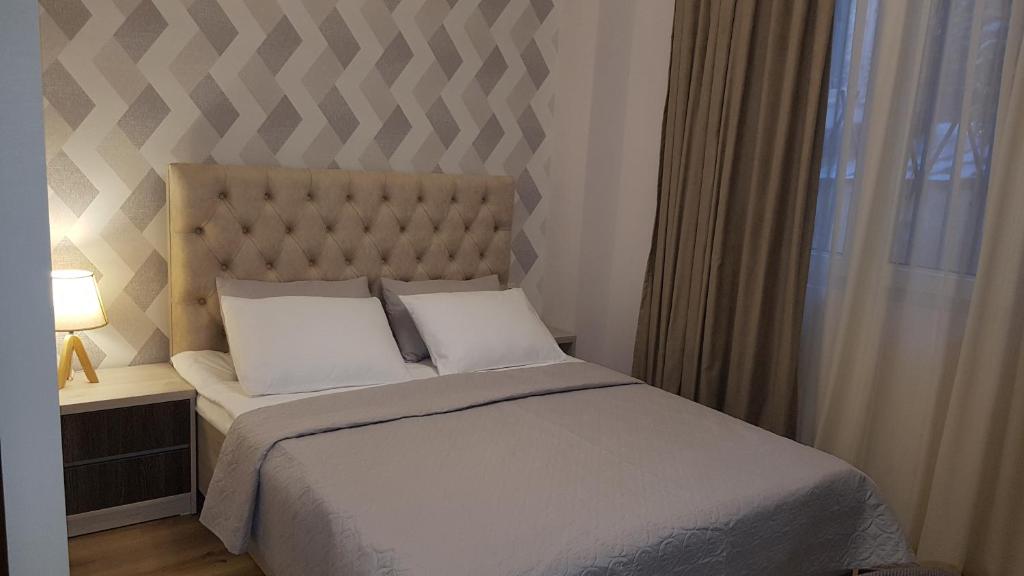 Postel nebo postele na pokoji v ubytování Hotel Griboedov