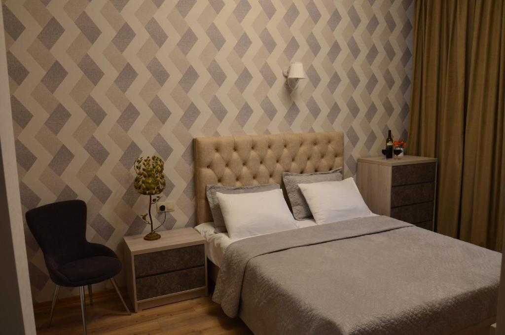 Postel nebo postele na pokoji v ubytování Hotel Griboedov