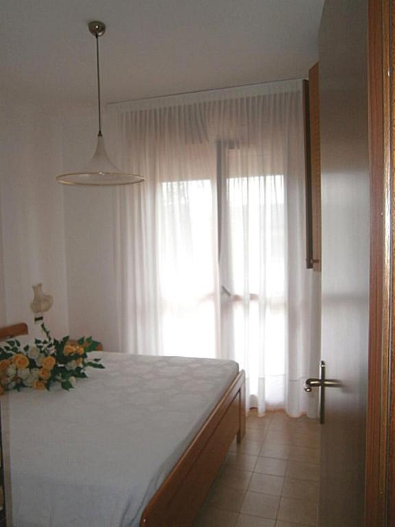 A bed or beds in a room at Andrea