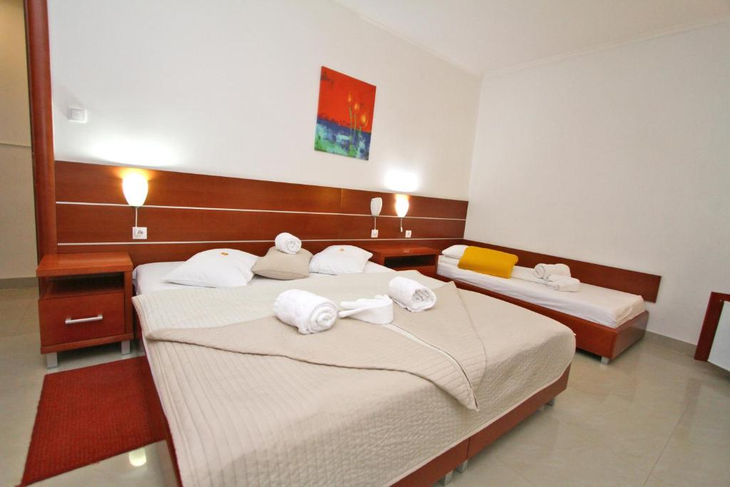 Postel nebo postele na pokoji v ubytování Guesthouse Villa Inn