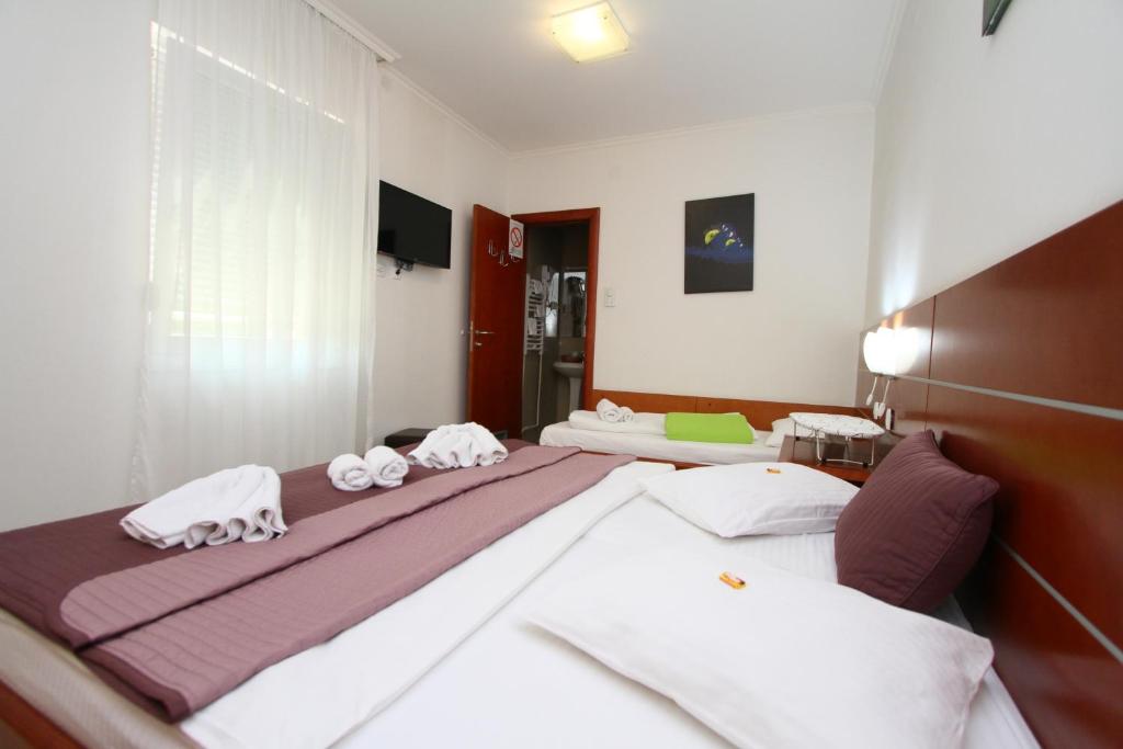 Postel nebo postele na pokoji v ubytování Guesthouse Villa Inn