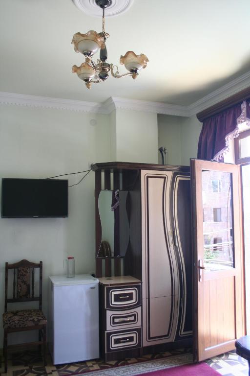 Kuchyň nebo kuchyňský kout v ubytování Hotel Noy