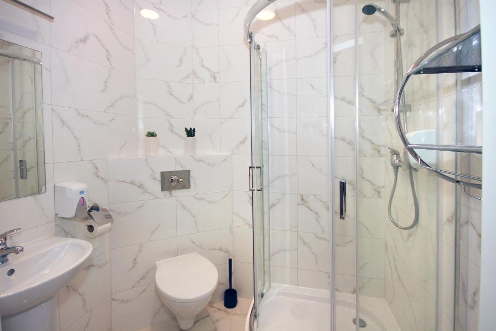 Koupelna v ubytování Willa Park Apartamenty
