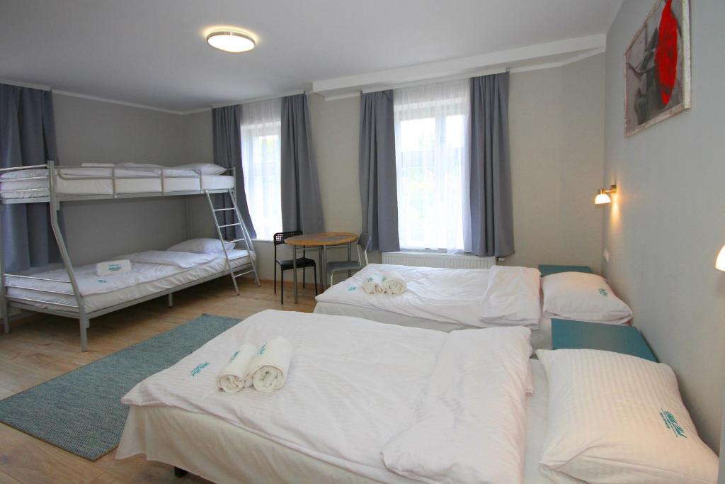 Postel nebo postele na pokoji v ubytování Willa Park Apartamenty