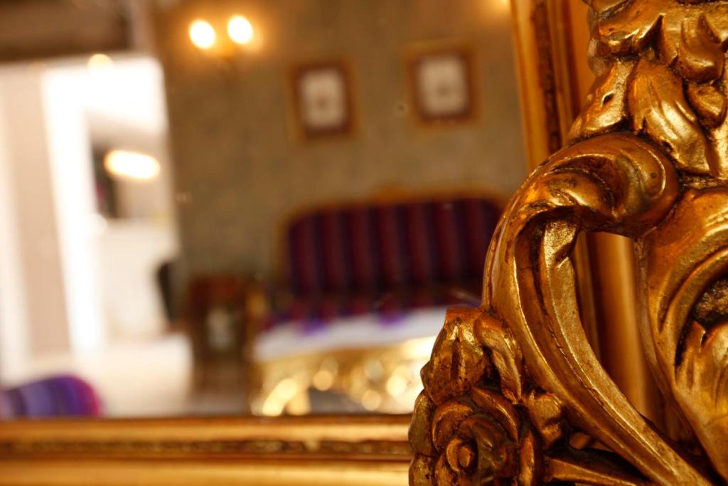 Voodi või voodid majutusasutuse Palazzo Radomiri Heritage Boutique Hotel toas