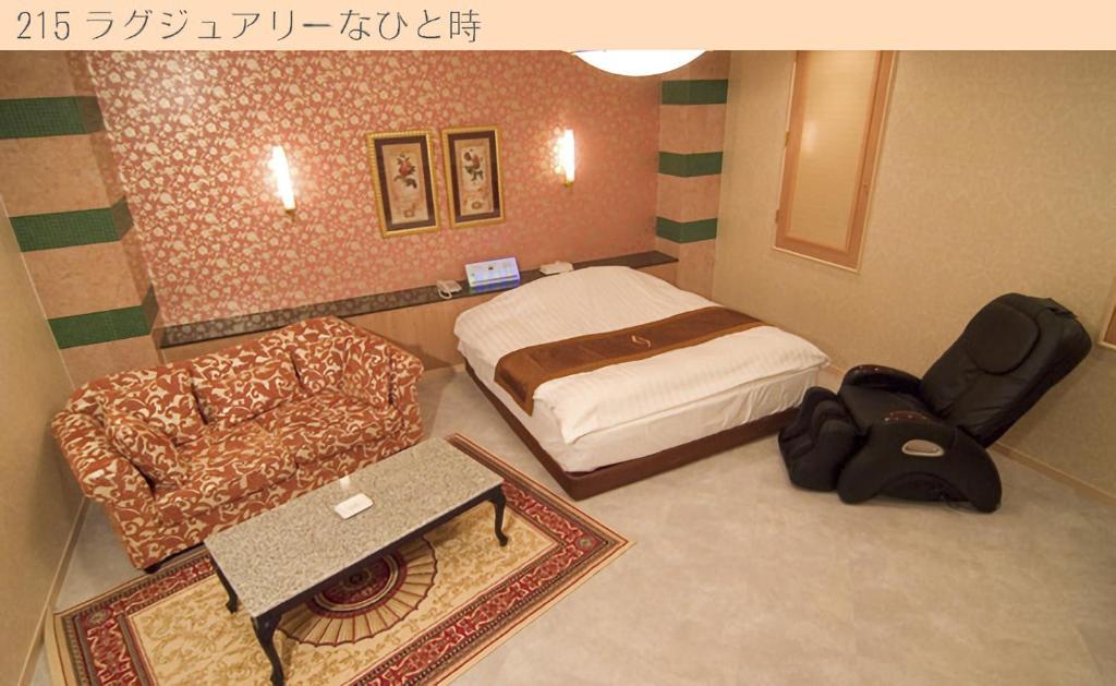 Postel nebo postele na pokoji v ubytování Hotel Very Matsusaka (Adult Only)