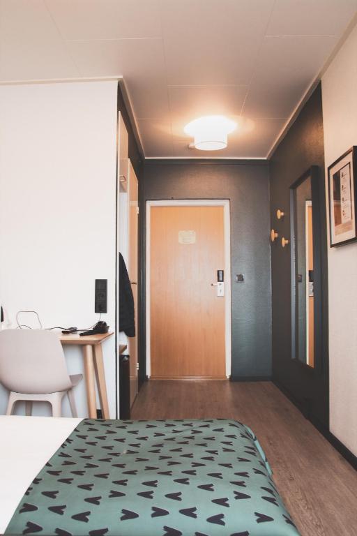 Postel nebo postele na pokoji v ubytování Hotel Aakenus