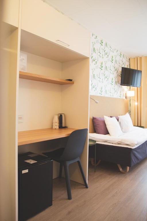 Postel nebo postele na pokoji v ubytování Hotel Aakenus