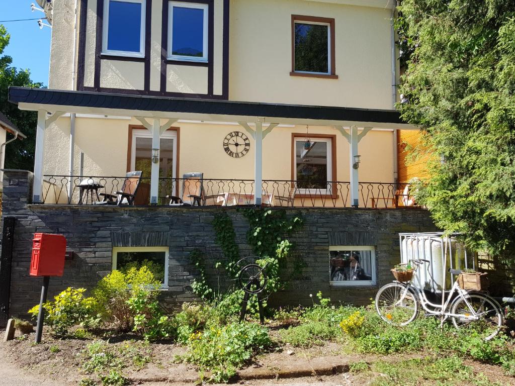 a house with bikes parked in front of it at Haus Lowe in Senheim