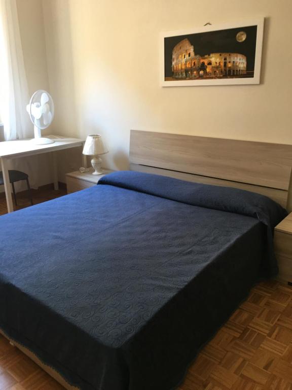 Łóżko lub łóżka w pokoju w obiekcie Appartamento - Casa vacanza Nonna Grazia