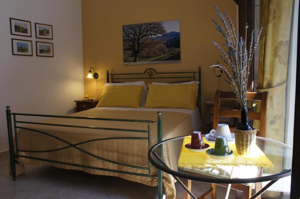 Postel nebo postele na pokoji v ubytování B&B Liolà