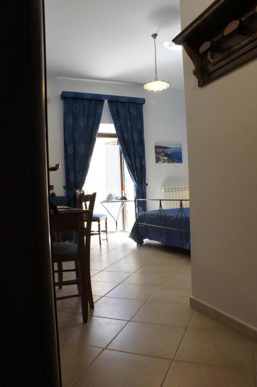 Postel nebo postele na pokoji v ubytování B&B Liolà