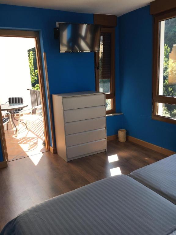 Cama o camas de una habitación en Narcea Turismo Real