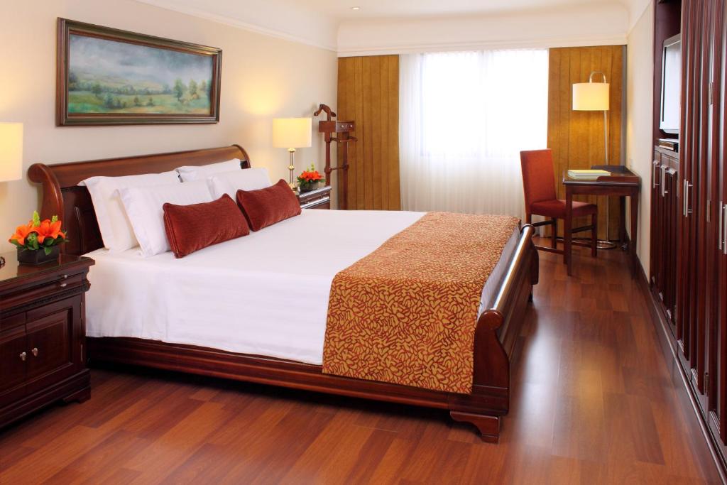 Postel nebo postele na pokoji v ubytování Hotel Estelar La Fontana