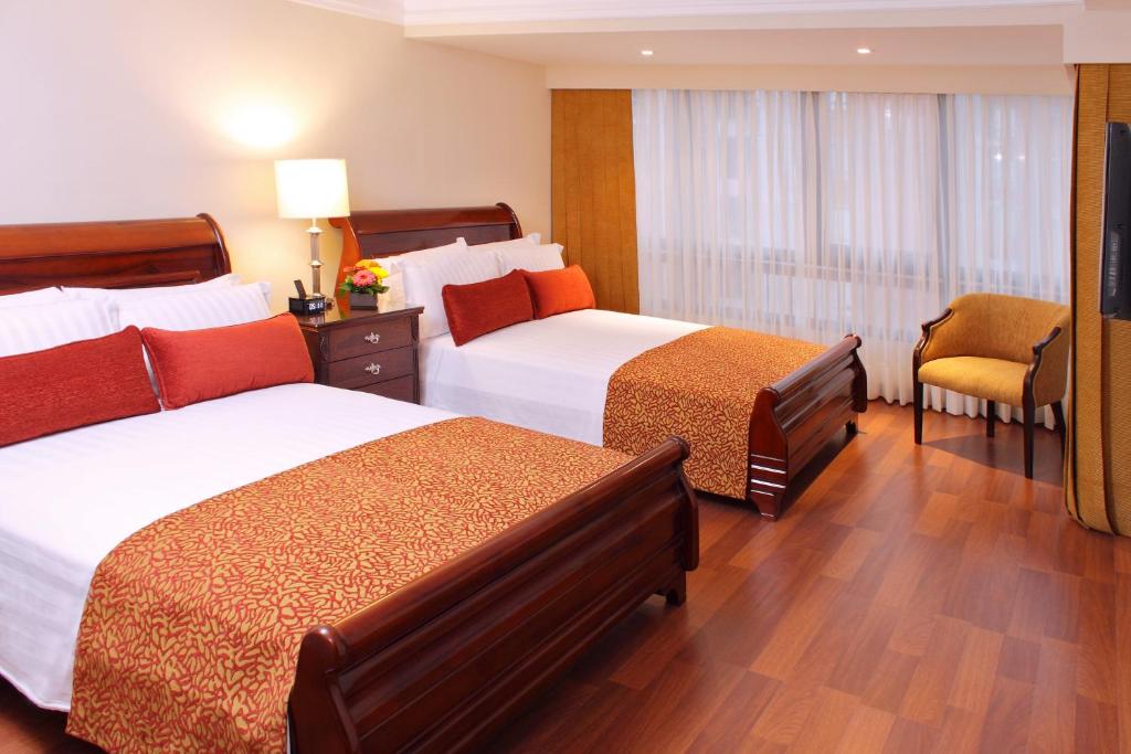 Postel nebo postele na pokoji v ubytování Hotel Estelar La Fontana