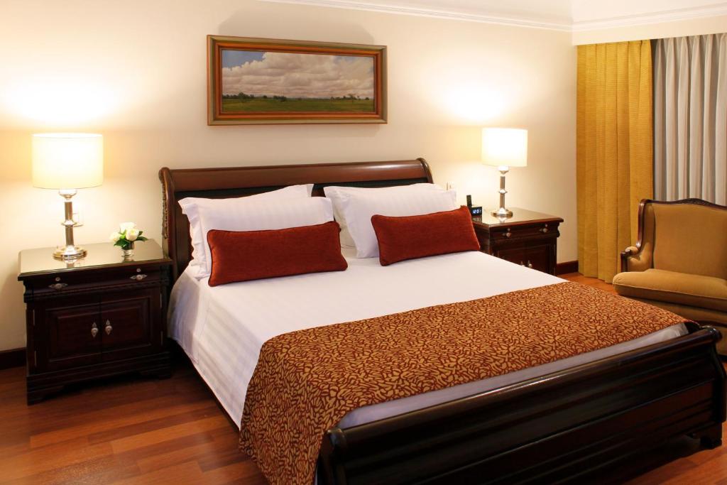 Postel nebo postele na pokoji v ubytování Hotel Estelar La Fontana