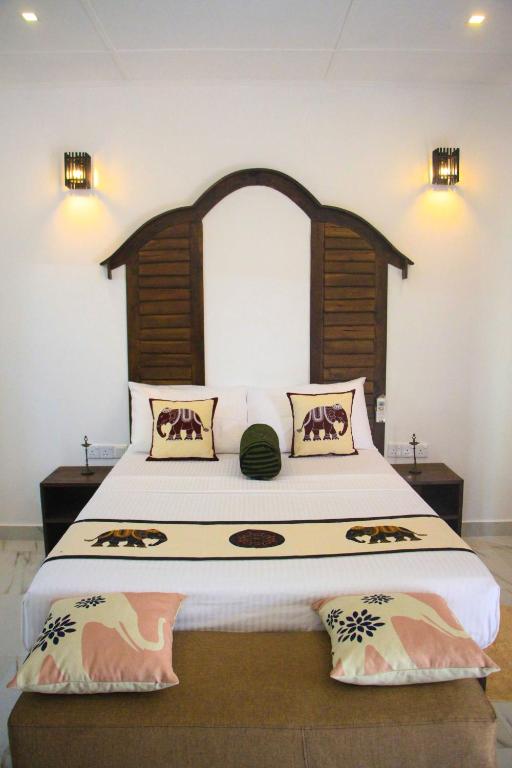 Postel nebo postele na pokoji v ubytování Palmyra Nature Resort Sigiriya