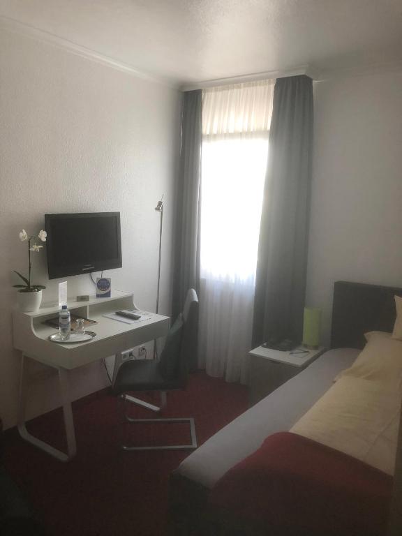TV a/nebo společenská místnost v ubytování Hotel Sechzehn