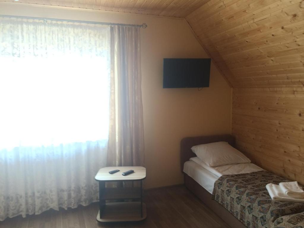 Postel nebo postele na pokoji v ubytování Camelot