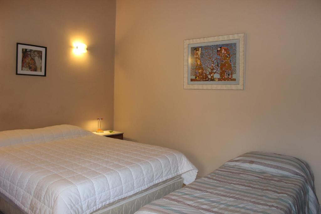 Voodi või voodid majutusasutuse Mandala Apartments toas