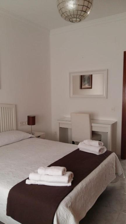 A bed or beds in a room at La Casa De La Tia