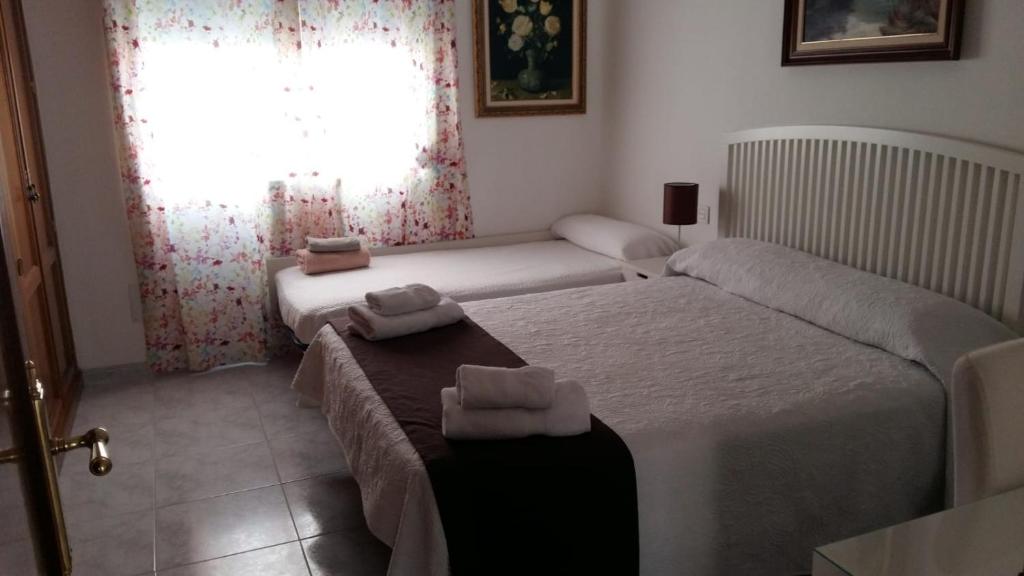 A bed or beds in a room at La Casa De La Tia