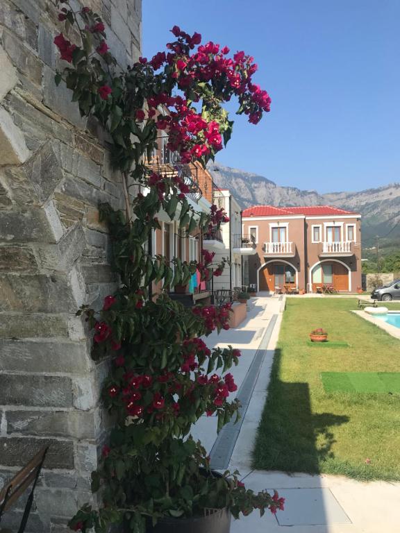 a bunch of flowers on the side of a building at Anthelia in Skala Potamias