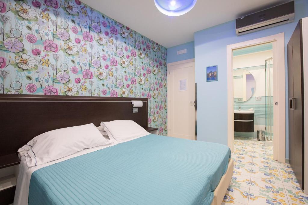 Postel nebo postele na pokoji v ubytování B&B Degli Aranci