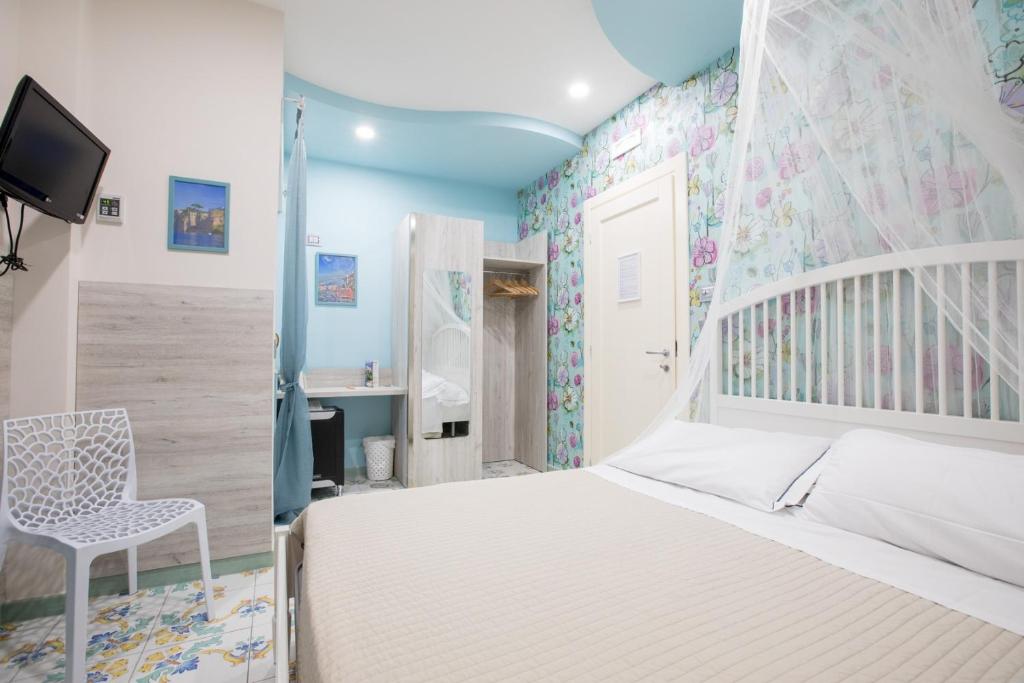 Postel nebo postele na pokoji v ubytování B&B Degli Aranci