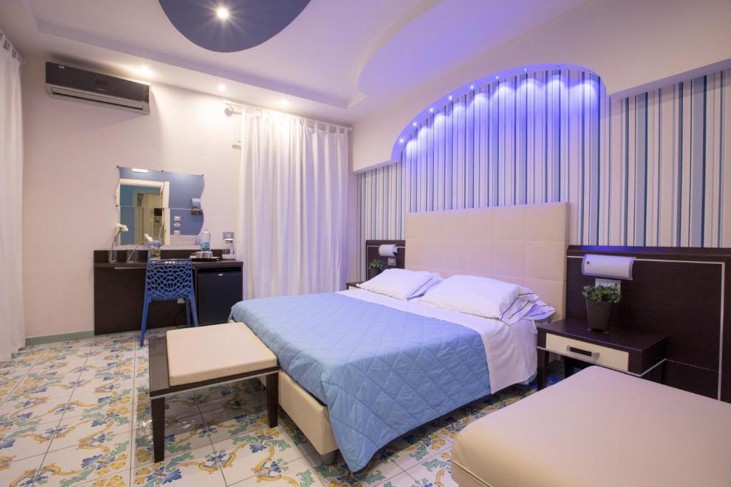 Postel nebo postele na pokoji v ubytování B&B Degli Aranci