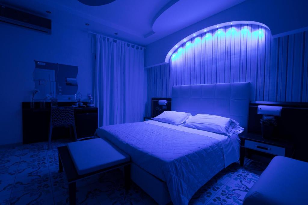 Postel nebo postele na pokoji v ubytování B&B Degli Aranci