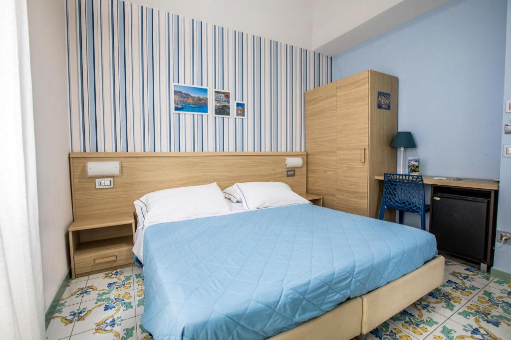 Postel nebo postele na pokoji v ubytování B&B Degli Aranci