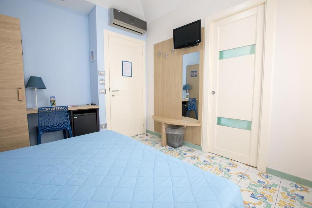 Postel nebo postele na pokoji v ubytování B&B Degli Aranci