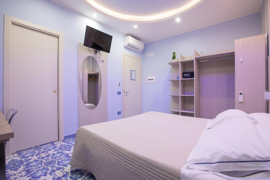 Postel nebo postele na pokoji v ubytování B&B Degli Aranci