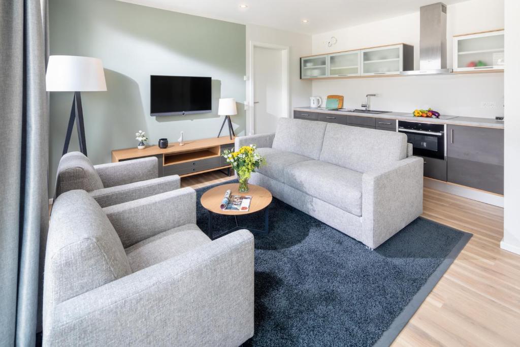 TV a/nebo společenská místnost v ubytování Apartmenthaus B3
