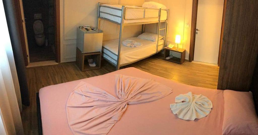 Uma cama ou camas num quarto em Hotel Golden