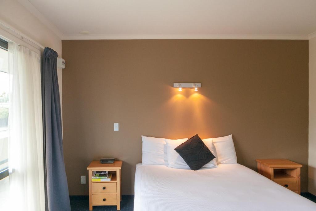 Postel nebo postele na pokoji v ubytování Stadium Motel