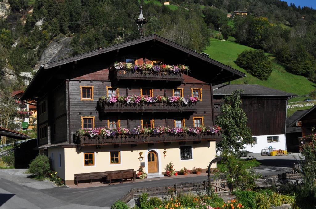 a building with flower boxes on the balcony at Tofererhof in Bad Hofgastein