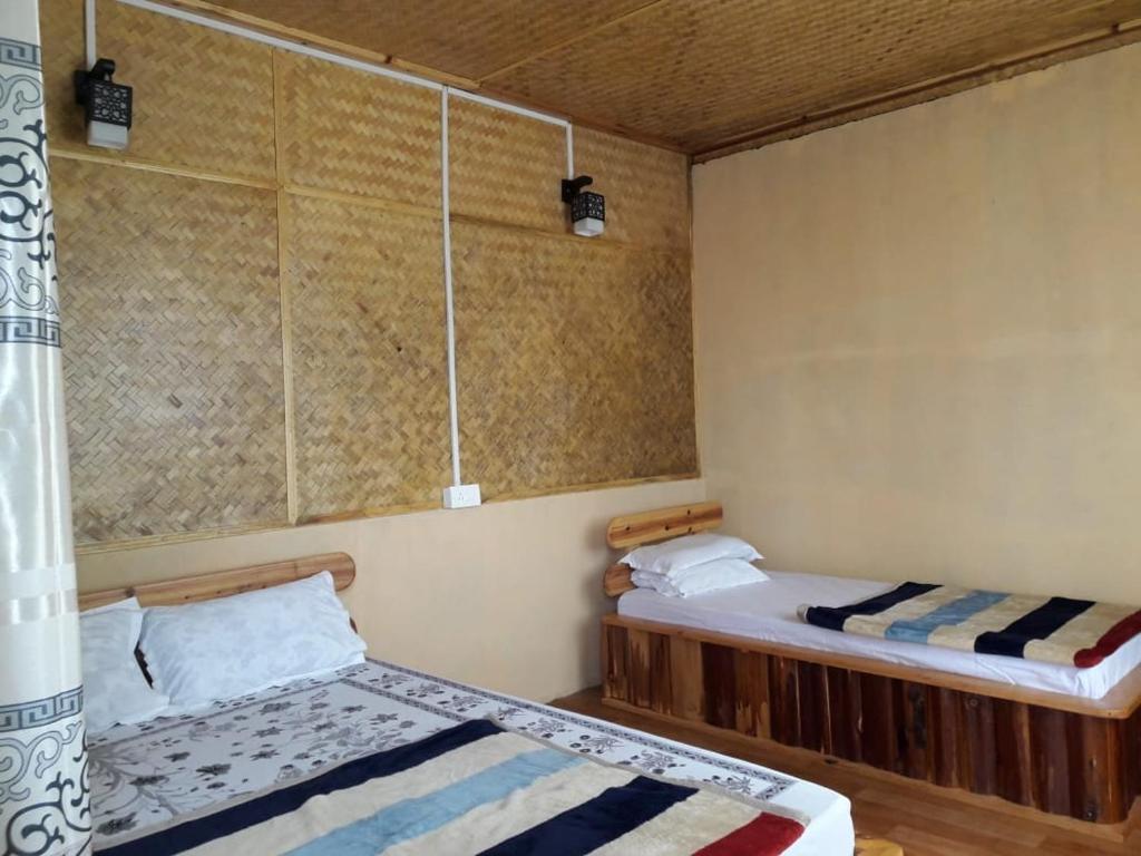 Postel nebo postele na pokoji v ubytování Vamoose Soshing Homestay