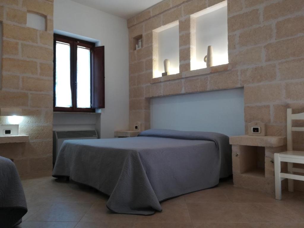 Postel nebo postele na pokoji v ubytování Masseria Don Sante