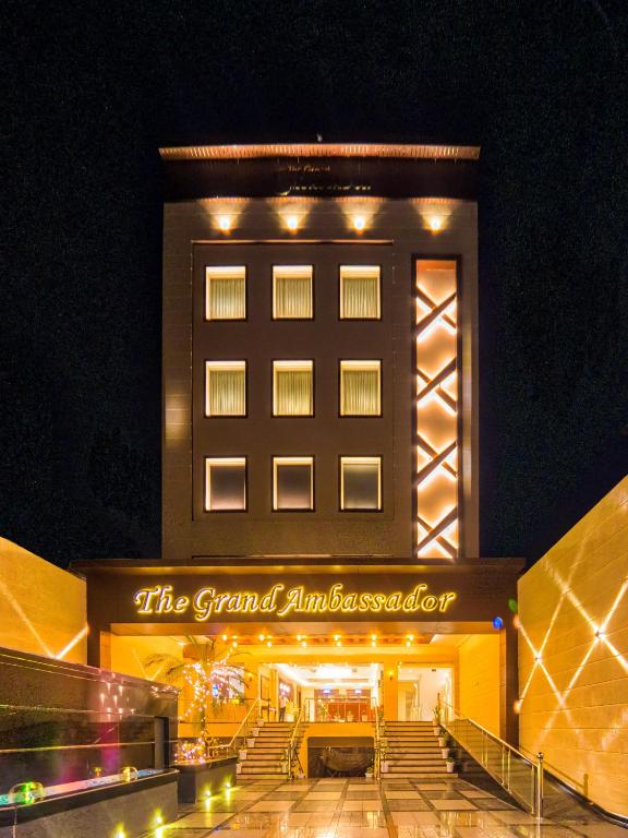 a building with a sign that reads the grand ambrosia hotel at The Grand Ambassador in Phagwāra