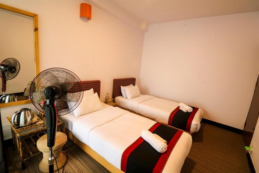 Postel nebo postele na pokoji v ubytování Easy Homes - Ashok Stupa